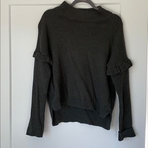Gray sweater with ruffle detail on sleeve